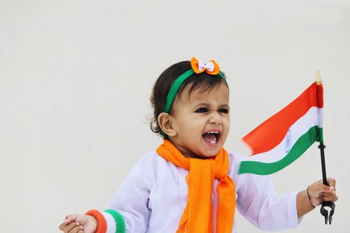 A Kid With Indian National Flag